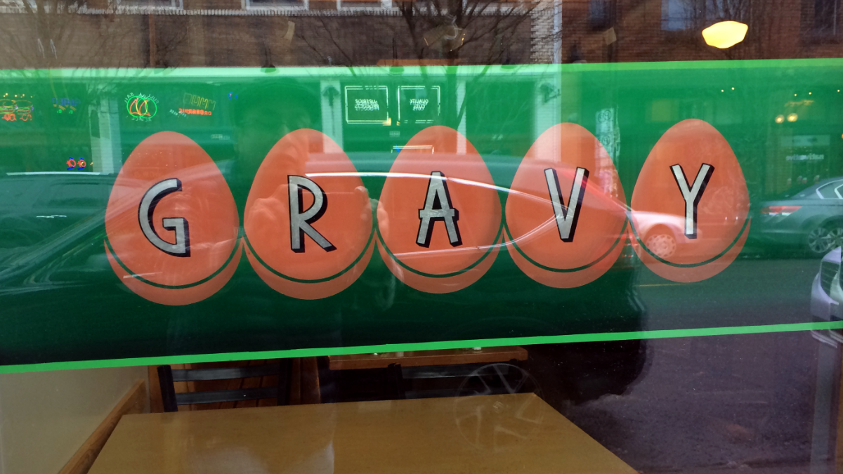 Silver leaf lettering over blended backgrounds on glass for Gravy restaurant