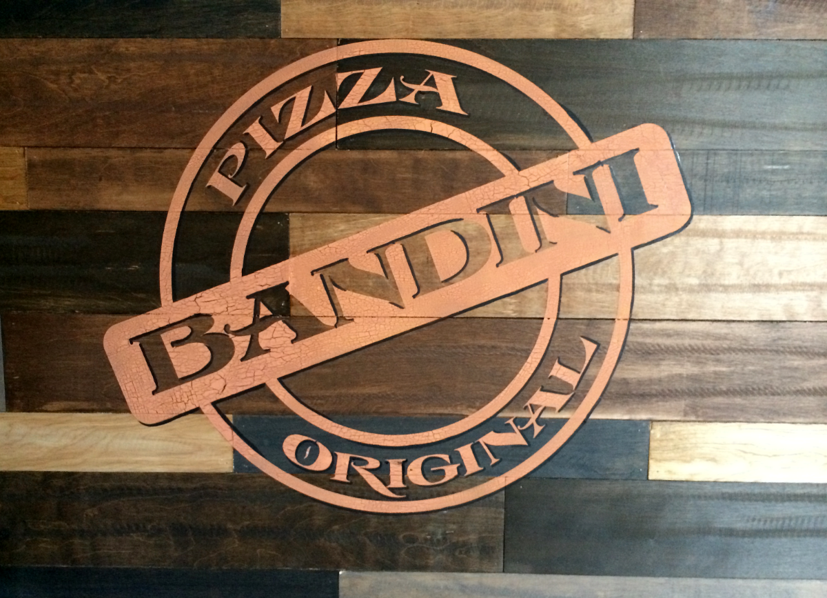 Cracked paint technique for Bandini's Pizza stamp on wooden wall