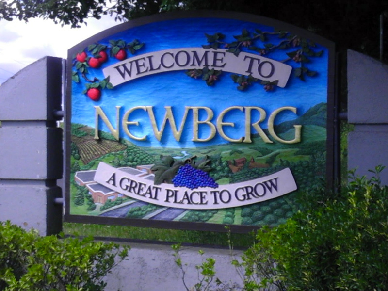 Refurbished carved & painted cedar sign, with 23k Gold leaf lettering, for Newberg Oregon (with Jerry Blankenship)